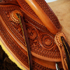 Half Breed Vaquero Wade Saddle by Keith Valley   Specs: Wade tree by Rick Reed 15 & 1/2 inch seat, Gullet - 7 & 1/2H X 6 & 1/4W X 4, 93 Degree Bars, Horn - 3 & 5/8ths high X 4 & 1/2 Guatelajara, Cantle - 4&1/2 inches high X 12&1/2 inches wide, Cheyenne Roll - 1 & 3/4 inches, 7/8ths flat plate riggin.  Sporting Keith's Vaquero Border with Sheridan Floral tooling within, Stainless Steel Hardware - by Harwood, 4 inch Monel Stirrups, Santa Barbara twisted for easy handling, Vaquero outside stirrup leathers, 100% handmade Mohair Roper Cinch, Hand cut 7 foot latigos for both sides.  Made for a special order - **SOLD** but we take orders.